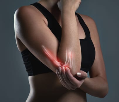 Follow the simple steps to prevent injuries during your workout. Studio shot of a sporty young woman.