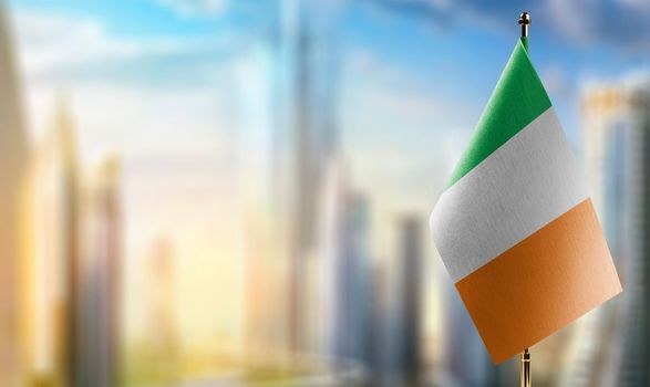 Small flags of the Ireland on an abstract blurry background