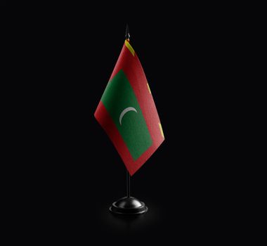 Small national flag of the Maldives on a black background