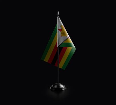 Small national flag of the Zimbabwe on a black background