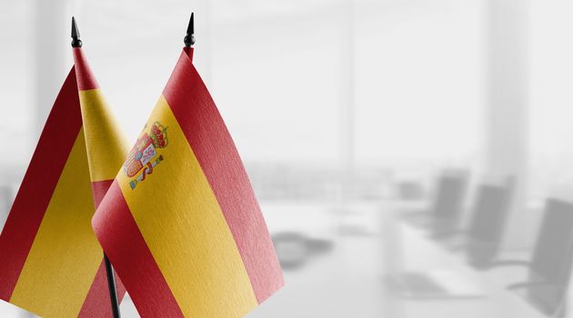 A small Spain flag on an abstract blurry background