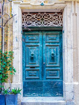 close up retro style old house door of Mediterranean architectural culture in Mediterranean island Malta