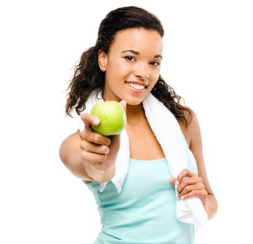 Ready to boost her own health. a healthy young woman about to eat an apple against a studio background.