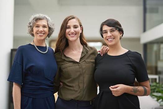 Together, were a force to be reckoned with. Cropped portrait of three businesswomen standing together in their office.