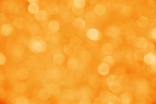 Abstract background of orange bokeh lights