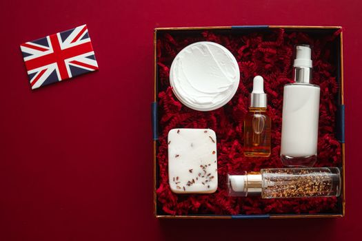 Beauty box subscription delivery in United Kingdom, luxury skincare products, spa and body care cosmetics and UK flag on red flat lay background, online shopping, flatlay view