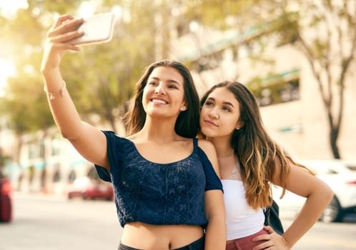 Selfie to remember this day with my bestie. two best friends taking a selfie in the city.