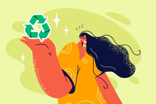 Smiling woman with recycling symbol in hands