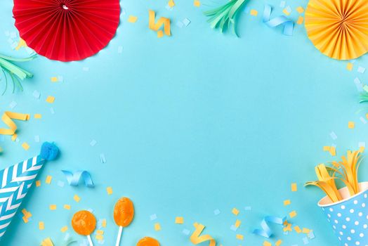 Celebration pattern with various party confetti on blue background. Flat lay