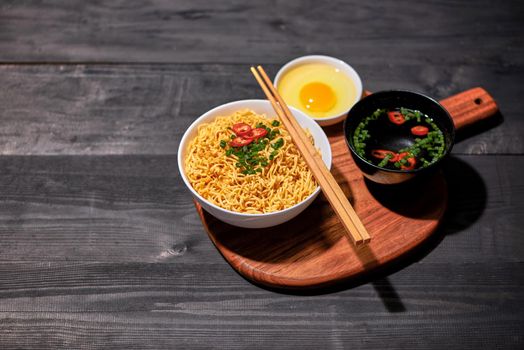 instant noodle in bowl cooked spicy taste topping with eggs
