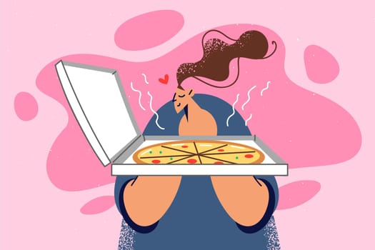 Happy woman smell tasty pizza in box