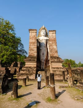 Women visit Wat Mahathat, Sukhothai old city, Thailand. Sukothai historical park