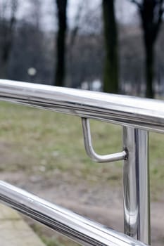 Metal railing stairs in the park close up