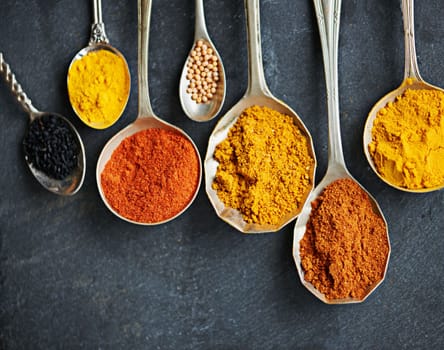 A spice for everyone. spoons filled with a variety of spices.