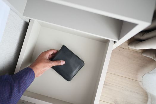 men stealing wallet from a drawer