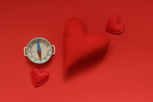 Valentines day background with red heart and compass.