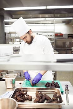 Prep is everything. chefs preparing a meal service in a professional kitchen.