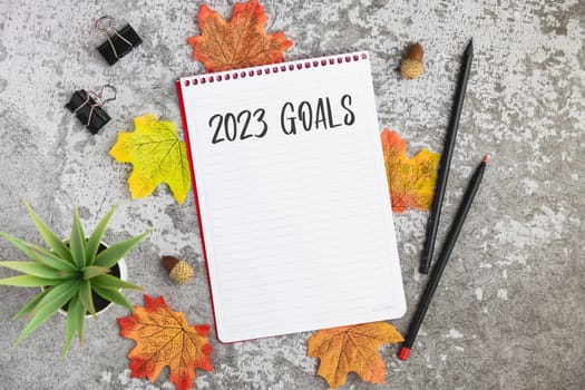 Notebook with 2023 goals written on it to make new plans in the new year