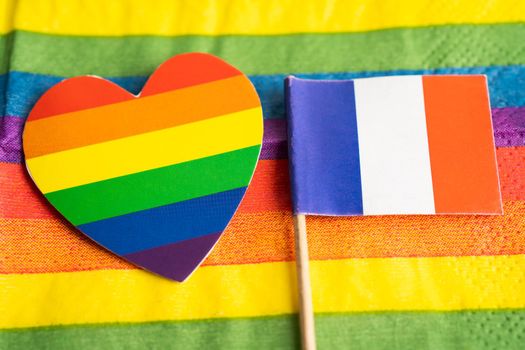 France flag on rainbow background flag symbol of LGBT gay pride month  social movement rainbow flag is a symbol of lesbian, gay, bisexual, transgender, human rights, tolerance and peace.