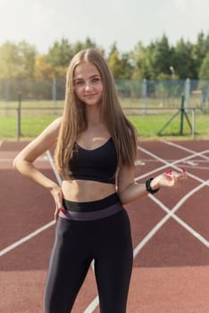 Young woman athlete runnner is exercising hurdles
