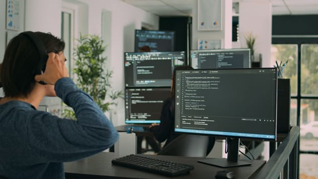 Software developer programming source code algorithm on computer