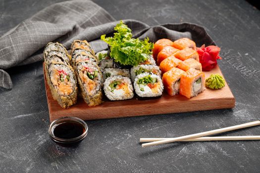 Side view sushi roll assorted set with soy sauce