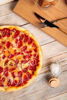 Hunter's sausage pizza on the wooden rustic table