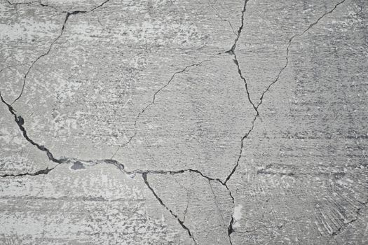 cracked asphalt after earthquake close up