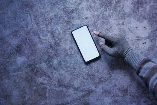 hacker hand stealing data from smart phone