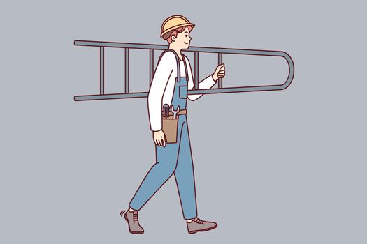 Man builder or professional repairman in overalls carries stepladder on shoulder