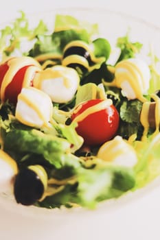 Food and diet, salad with fresh vegetables and mozzarella cheese as meal for lunch or dinner, tasty recipe