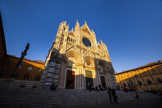 SIENA, ITALY.October 13, 2018: Sunset and view of Siena's Cathedral of Santa Maria Assunta Duomo di Siena in Siena
