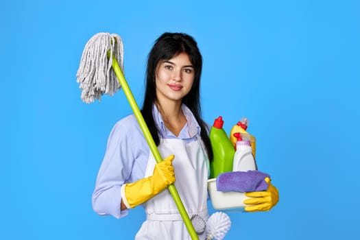 woman in gloves holding bucket of detergents and mop