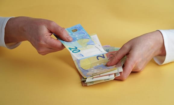 Euro Money. Female hands holding euro banknotes.