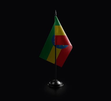Small national flag of the Ethiopia on a black background