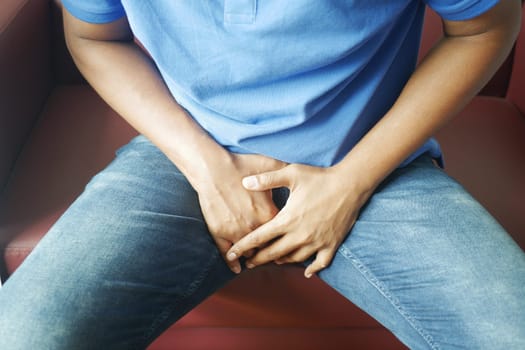 the concept of prostate and bladder problem, crotch pain of a young person
