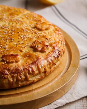 Baked pie with beef and pumpkin filling