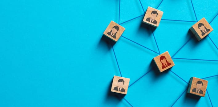 Organization structure, social network and teamwork concept on blue background. Business people icon on wooden cube blocks connecting network of connections