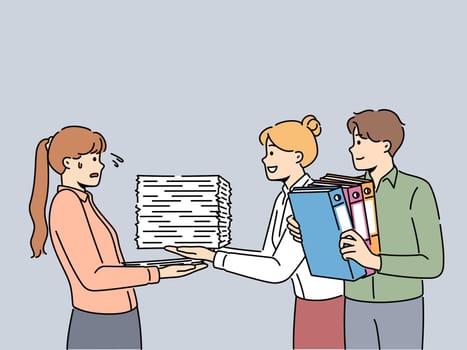 Smiling employees give paperwork to stressed worker