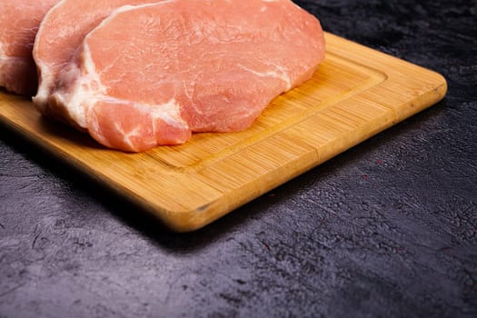 Close up on Fresh raw meat on wooden board