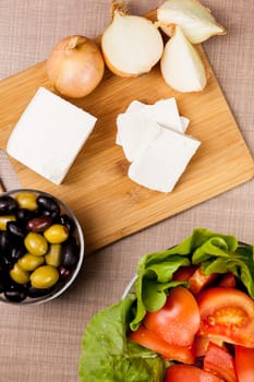Top view of feta white cheese on wooden board