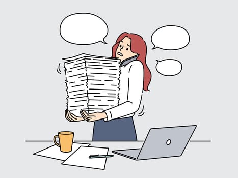 Businesswoman with paperwork stacks overwhelmed with work