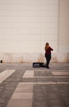 Female violinist playing in the street