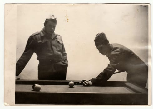 A vintage photo shows soldiers play pool, circa 1965.