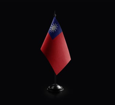 Small national flag of the Taiwan on a black background