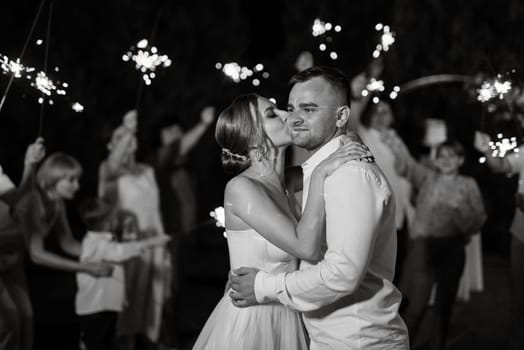 newlyweds at a wedding of sparklers