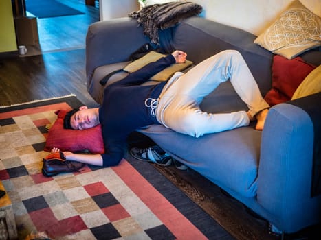 Drunk Man Resting on Couch with head on the Floor