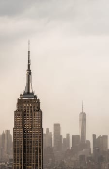 Futuristic view of a skyscraper tower in a light haze of fog or smog
