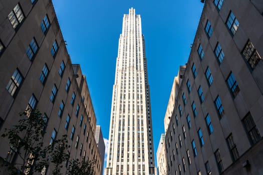 A high tower of a skyscraper reaching high into the sky. Symbol of progress and human power