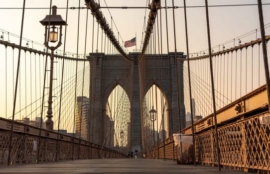 View of the arch of the Brooklyn Bridge early in the morning